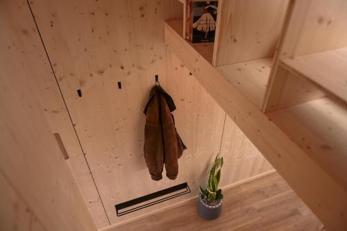 an overhead view of a tree house with a coat hanging from it at Tiny House Nook 1 - Green&Tiny Hideaway Eider in Süderstapel