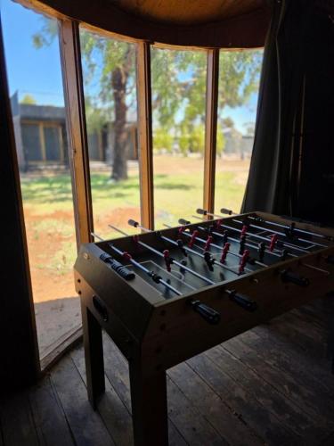 a room with a chess board in front of a window at Kangaroo Lake C & V Park in Mystic Park