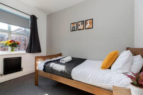 a bedroom with a bed and a window at DiscountsContractorsWIFIFree ParkingSmart TV in Gateshead