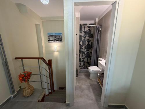 a bathroom with a staircase and a toilet in a room at 11 Diamond Drive, Luxury Bright & Quiet City Center Loft, Easy Access in Kavála