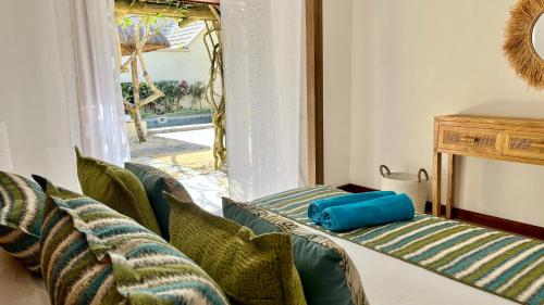 a living room with a couch and a window at Searenity Villa in Grand-Baie