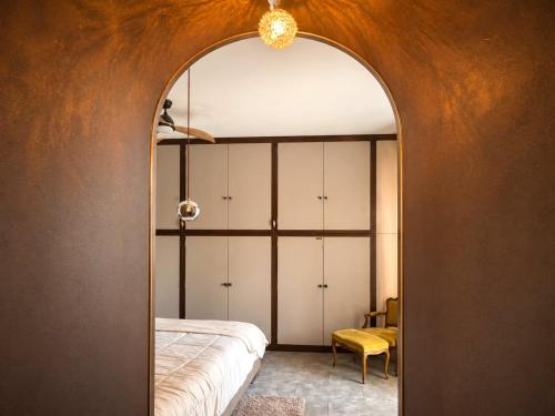 a room with a bed and a mirror at Spacious Apartment near Lake Maggiore in Luino