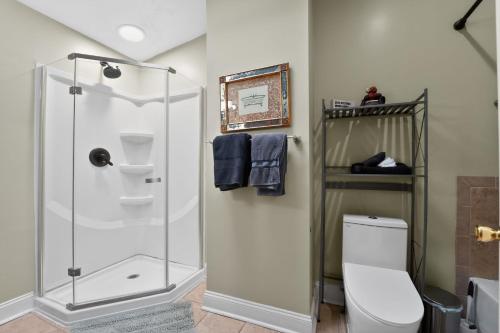 a bathroom with a shower and a toilet at Baltimore premier townhouse in Baltimore