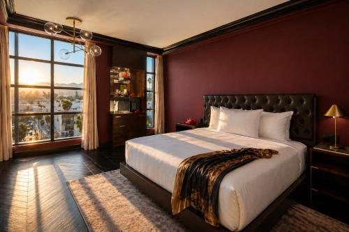 a bedroom with a large bed and a large window at Whisky Hotel in Los Angeles