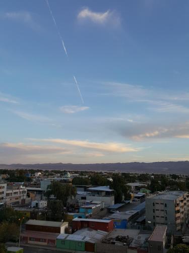 a view of a city with a kite in the sky at 2 Torres Calama in Calama