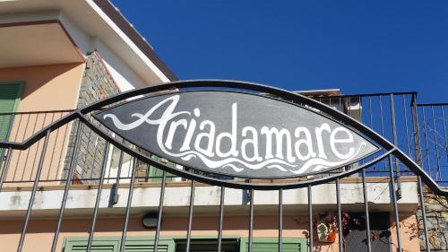 a sign on a gate in front of a building at B&B Ariadamare in Sanremo