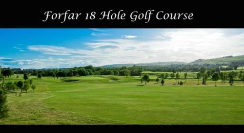 a view of a golf course with a green field at One Strathview B&B in Forfar