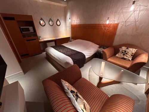 gull HOTEL tesisinde bir odada yatak veya yataklar
