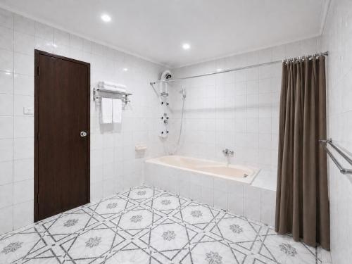 a bathroom with a bath tub and a shower at Keba Guest House - Addis Ababa in Addis Ababa