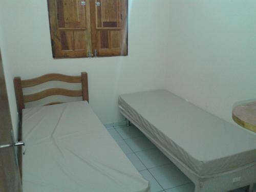 Säng eller sängar i ett rum på Casa Verde Maragogi