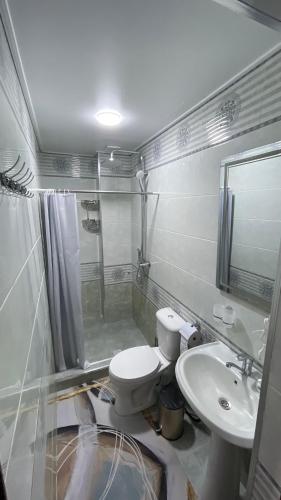 a bathroom with a toilet and a sink at Khiva Mahliyo in Khiva