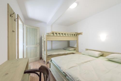 Postel nebo postele na pokoji v ubytování Guesthouse Tolc