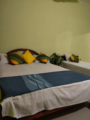 two beds sitting next to each other in a room at AS Villa Homestay in Varkala