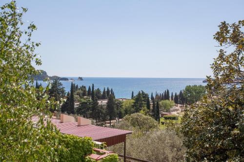 a view of the ocean from a house at Panorama Apartments in Budva