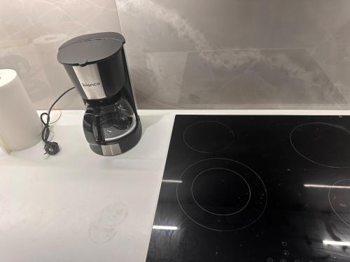 a coffee maker sitting on top of a counter at Nafplio Garden House in Nea Tiryntha