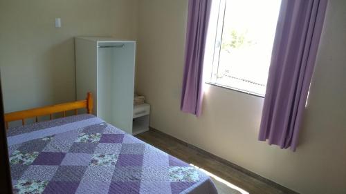 Ένα ή περισσότερα κρεβάτια σε δωμάτιο στο Pousada Araçatuba