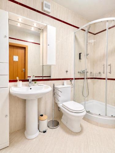 a bathroom with a toilet and a sink and a shower at Apartman Nina Selce in Selce