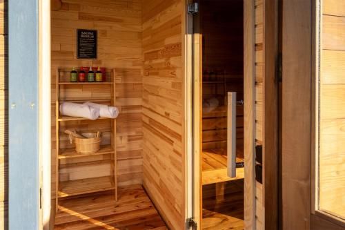 a sauna with wooden walls and wooden shelves at Bayerwald-Bungalow in Grattersdorf