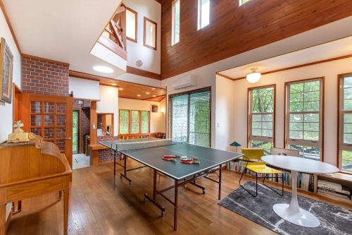 a living room with a ping pong table in it at S-villa那須Audrey in Nasu