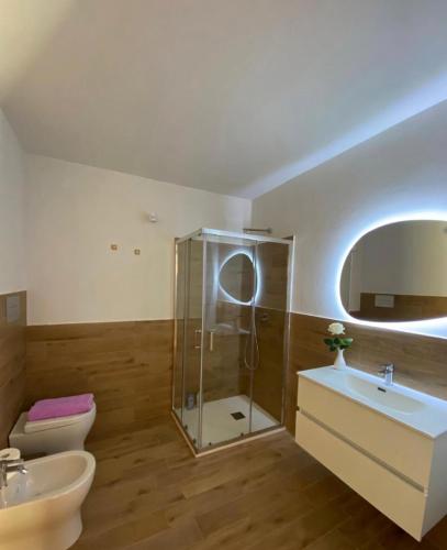 a bathroom with a shower and a toilet and a sink at Le tenute di punta bianca in Agrigento