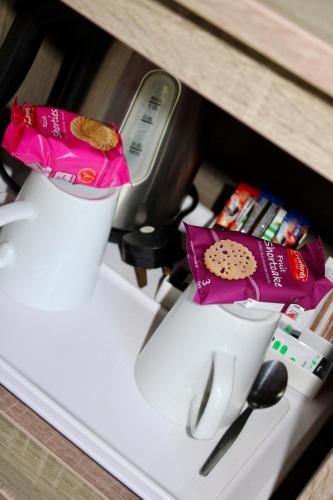 a white blender sitting on top of a shelf at Riverstone Lodge Hotel in Perth