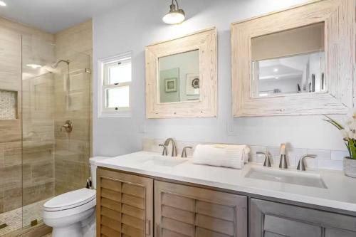 a bathroom with a sink and a toilet and a shower at Pacific Combo WOcean View Private Patio in Ventura