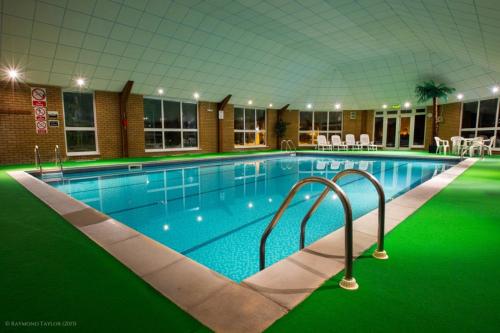 The swimming pool at or near Wensum Valley Hotel Golf and Country Club 