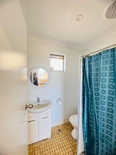 a bathroom with a sink and a toilet at Ocean View Villas in Geraldton
