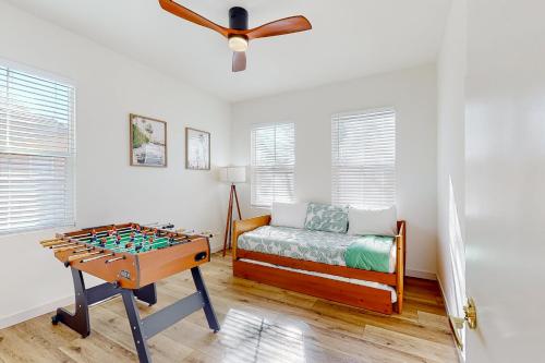 a room with a foosball table and a bed at Tranquil Desert Sanctuary in Indio