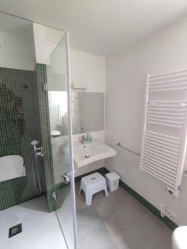 a bathroom with a sink and a shower at GuestHouse Tana del Riccio Todi in Todi