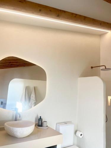 a bathroom with a white sink and a mirror at Casa Marítima in Altea
