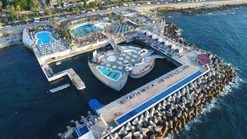 an overhead view of a cruise ship in the water at Riviera Hotel and Beach Lounge, Beirut in Beirut