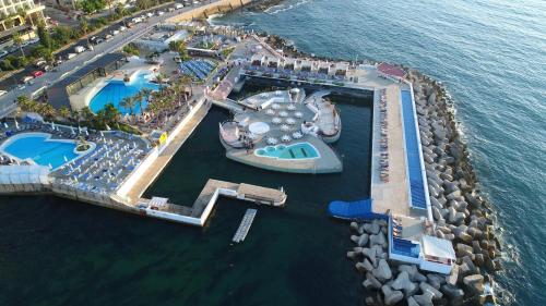 an aerial view of a resort in the water at Riviera Hotel and Beach Lounge, Beirut in Beirut