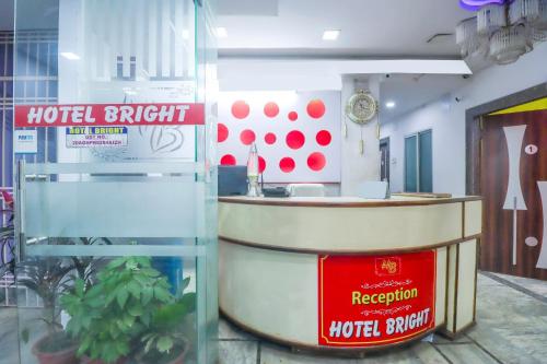 a hotel kitchen with a counter in a room at Hotel O Bright in Jamshedpur