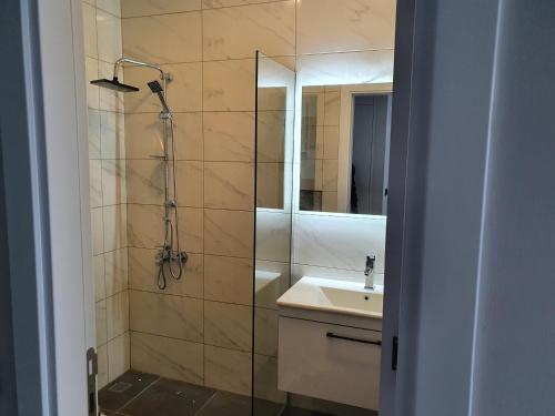 a bathroom with a shower and a sink at A dreamy luxury one-bedroom apartment with special views of the forest, sea and sunset in Alanya