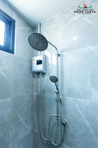 a shower in a bathroom with a shower at Ck Home Lanta in Phra Ae beach