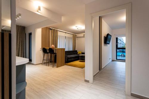 a living room with a couch and a table at Modern 2BR Balcony View Pipera in Voluntari