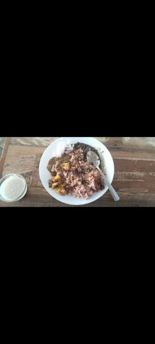 a plate of food on a wooden table at The Mount lakes in Bhīm Tāl