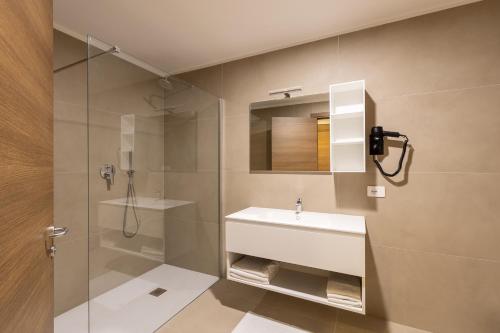 a bathroom with a sink and a shower at Park Hotel Gemona in Gemona del Friuli