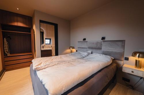 a bedroom with a large bed in a room at Modern Aurora Retreat in Selfoss