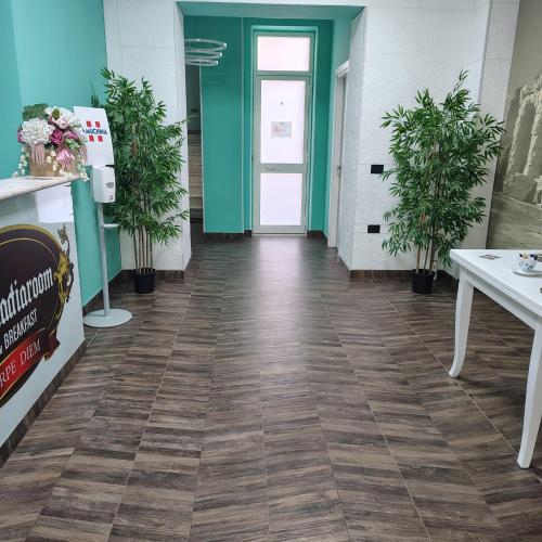 a hallway of a store with a tile floor at B&B Luxury Suite Le Gladiaroom in Santa Maria Capua Vetere