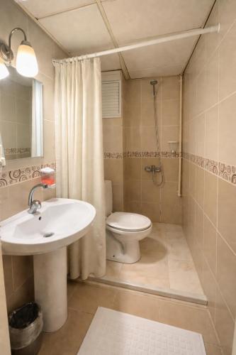 a bathroom with a sink and a toilet at Coskun Otel Şarköy in Şarköy