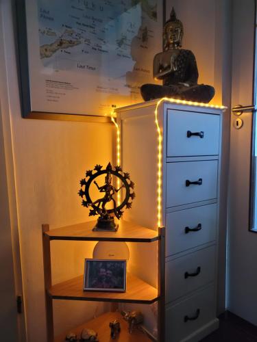a room with a dresser with lights on it at sky home room 2 in Amsterdam