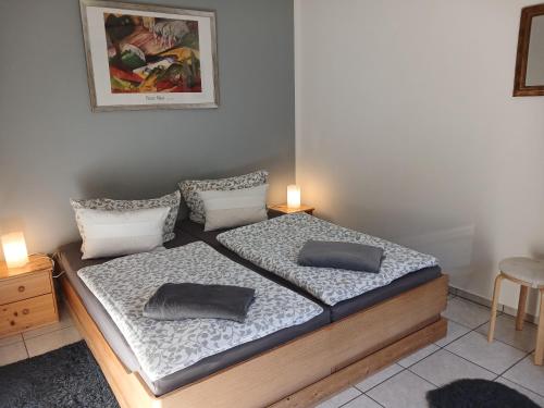 a bedroom with a bed with two pillows on it at Ferienwohnung Blum in Antweiler