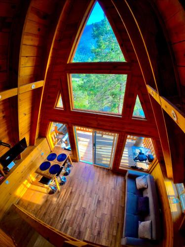 an overhead view of a living room with a large window at Glamping MORET Cabaña Alpina M2 in Los Lirios