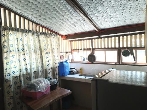 a kitchen with a sink and a counter top at Henalric's Place in Caramay