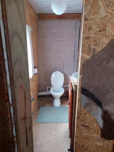a small bathroom with a toilet in a room at Cozy Corner Unit 1 and unit 2 in Bredasdorp