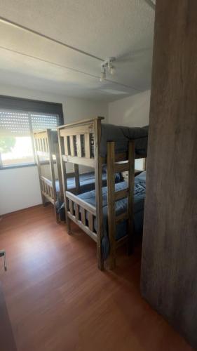 a bedroom with two bunk beds in a room at Hostel All inclusive in Zárate