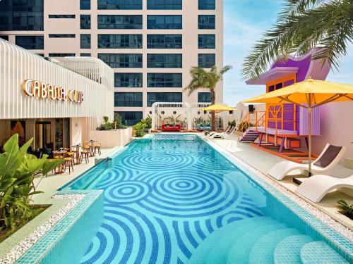 a swimming pool in the middle of a building at Mövenpick Hotel Hanoi Centre in Hanoi