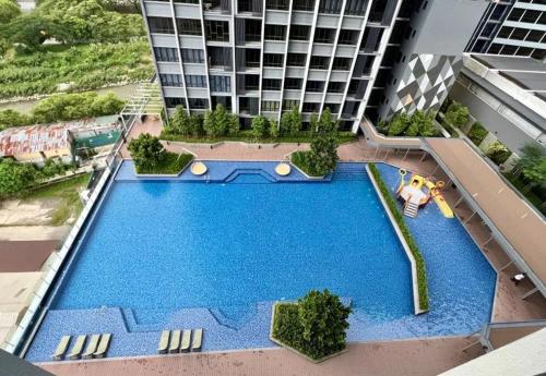 an overhead view of a swimming pool in a building at Miller Cozy Home in Kuala Lumpur